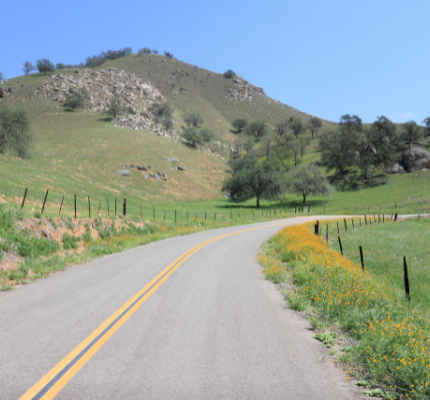 Country road with green hills